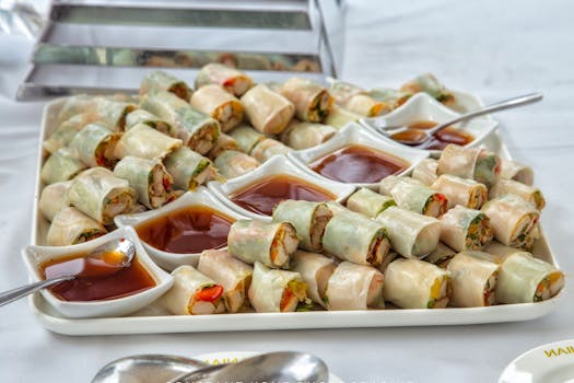 A delicious assortment of fresh spring rolls served with flavorful dipping sauces.
