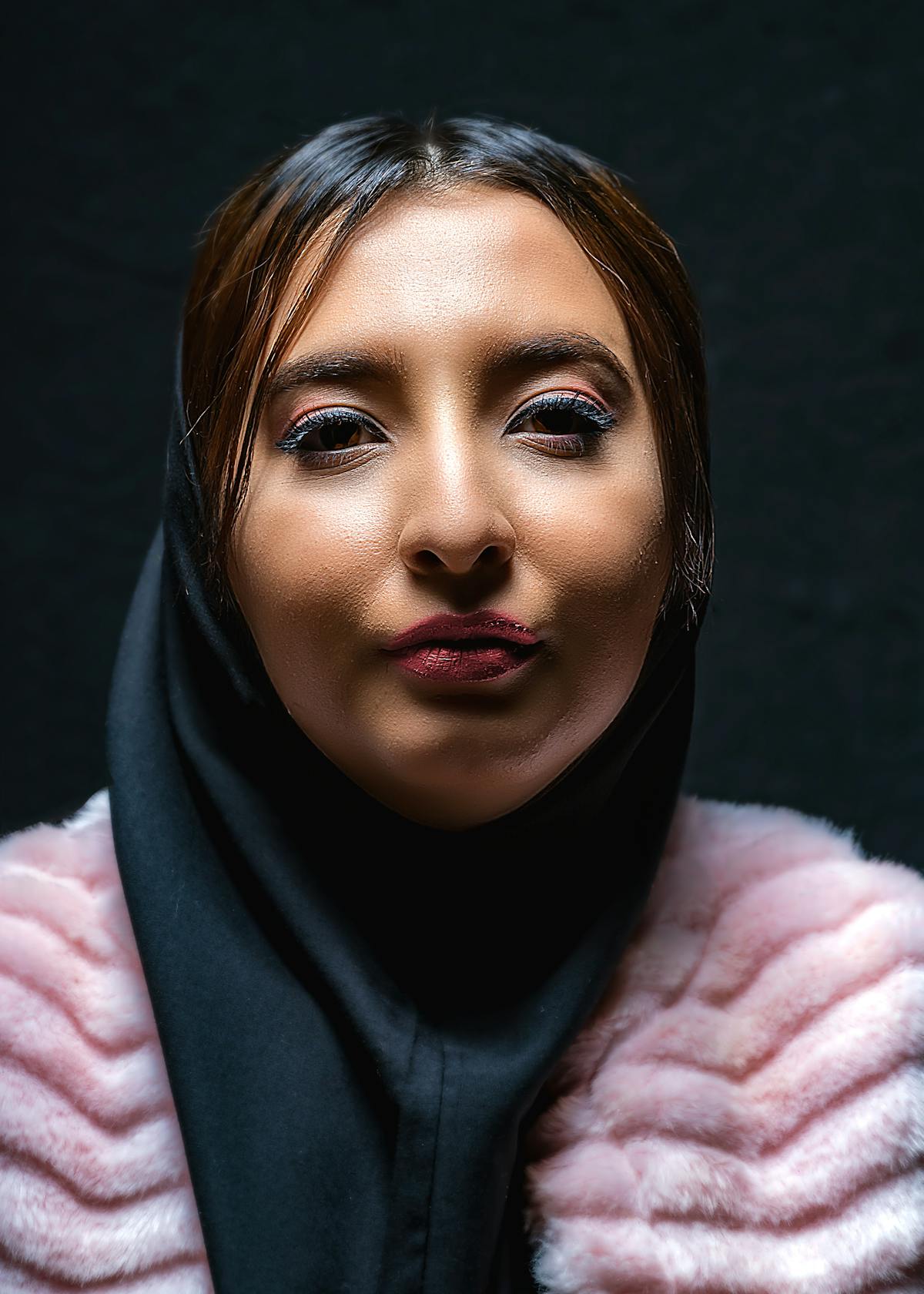 Two women sitting by a window and talking intimately over coffee
