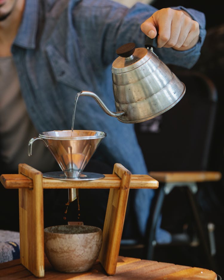 Crop Faceless Man Pouring Hot Water Into Pour Over Filter