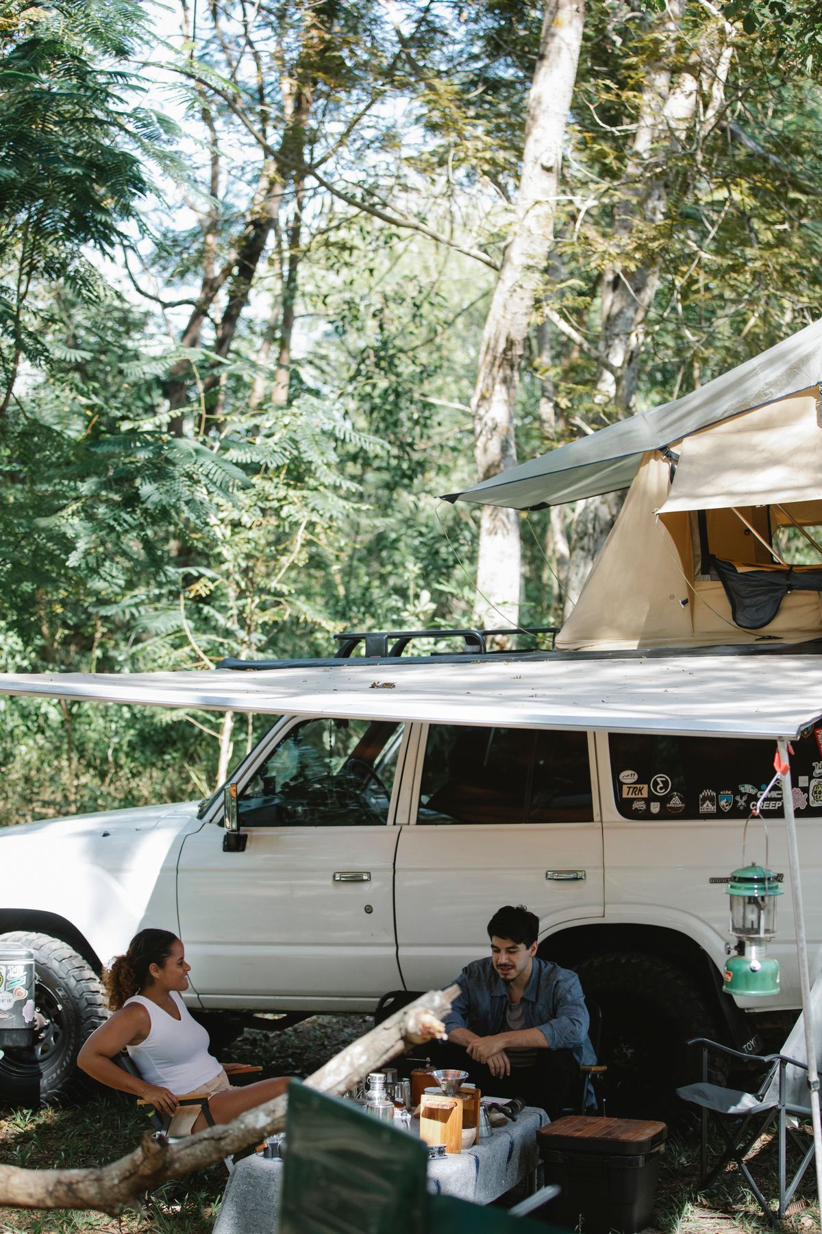 Vehicle-side camping cooler and kitchen setup