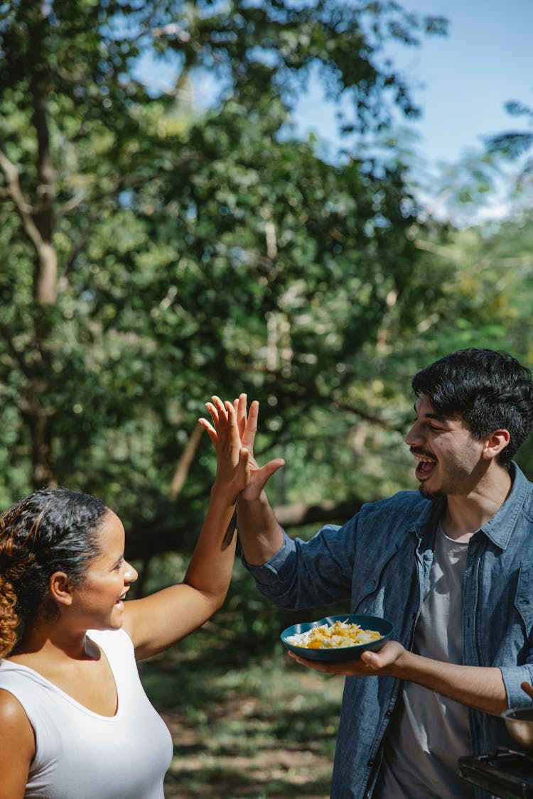 Happy Diverse Couple Giving Each Other High Five