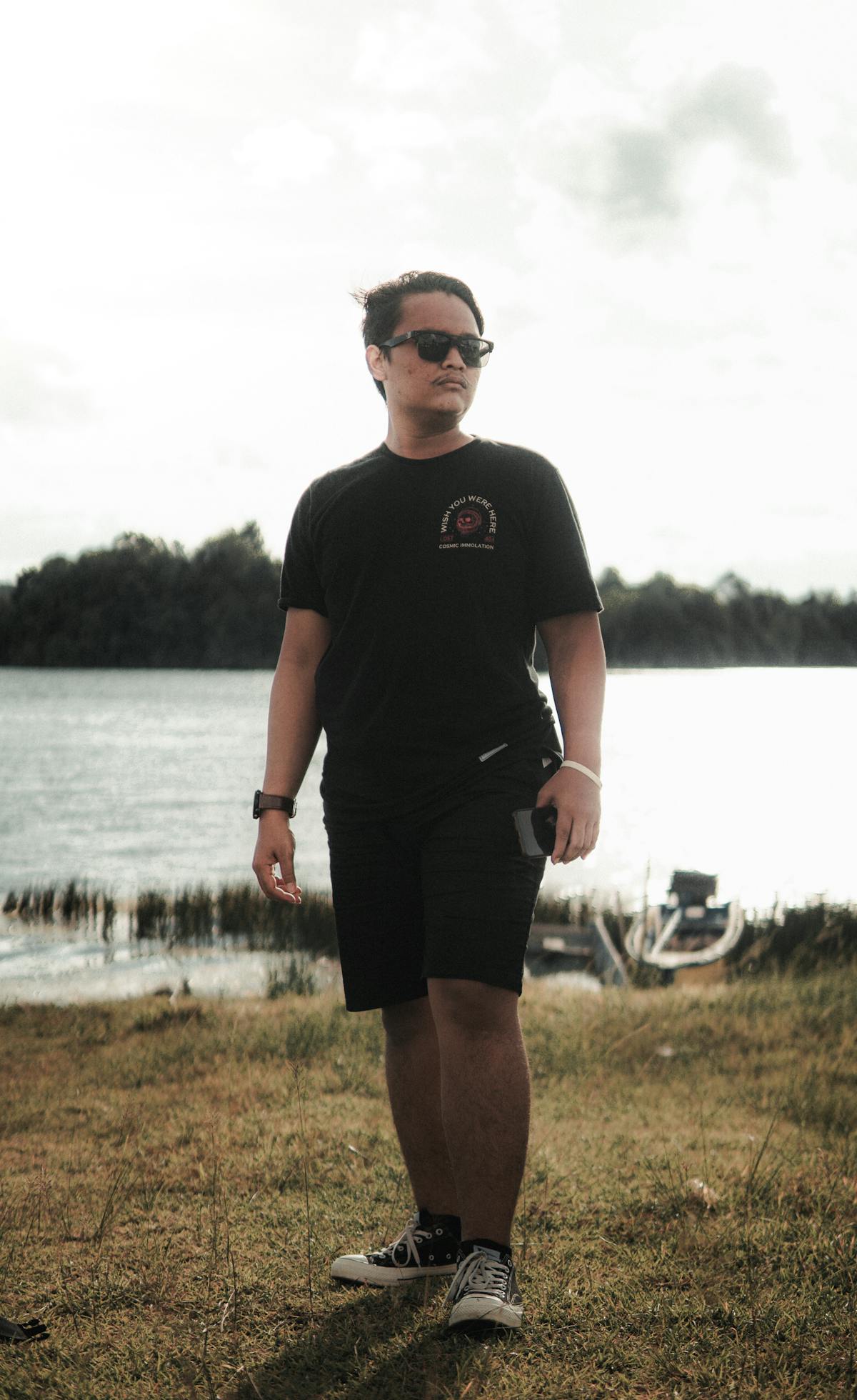Golden Retriever wearing a Christmas bandana sitting calmly in a festive living room