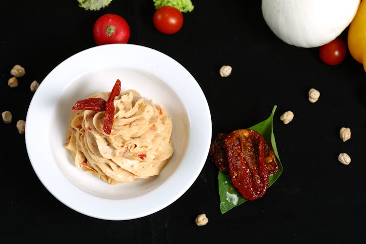 Overhead Shot Of Sun Dried Tomato Dip In A Bowl