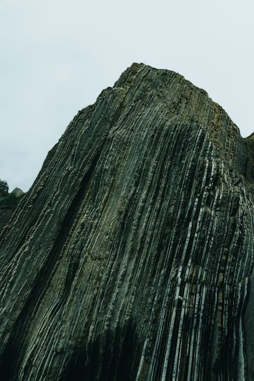 Steep rough rocky formation in mountainous terrain