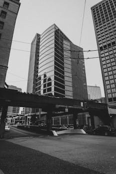 Black and white contemporary multistory glass buildings located in urban downtown in metropolis