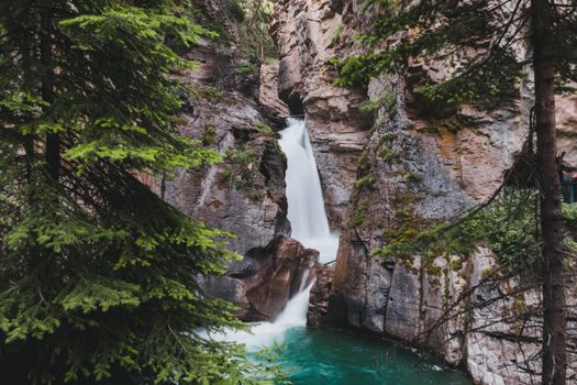 Rapid waterfall in rough mountainous terrain