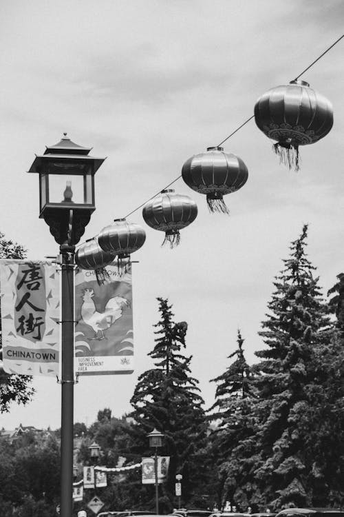 Free Traditional oriental lanterns hanging near streetlamp Stock Photo