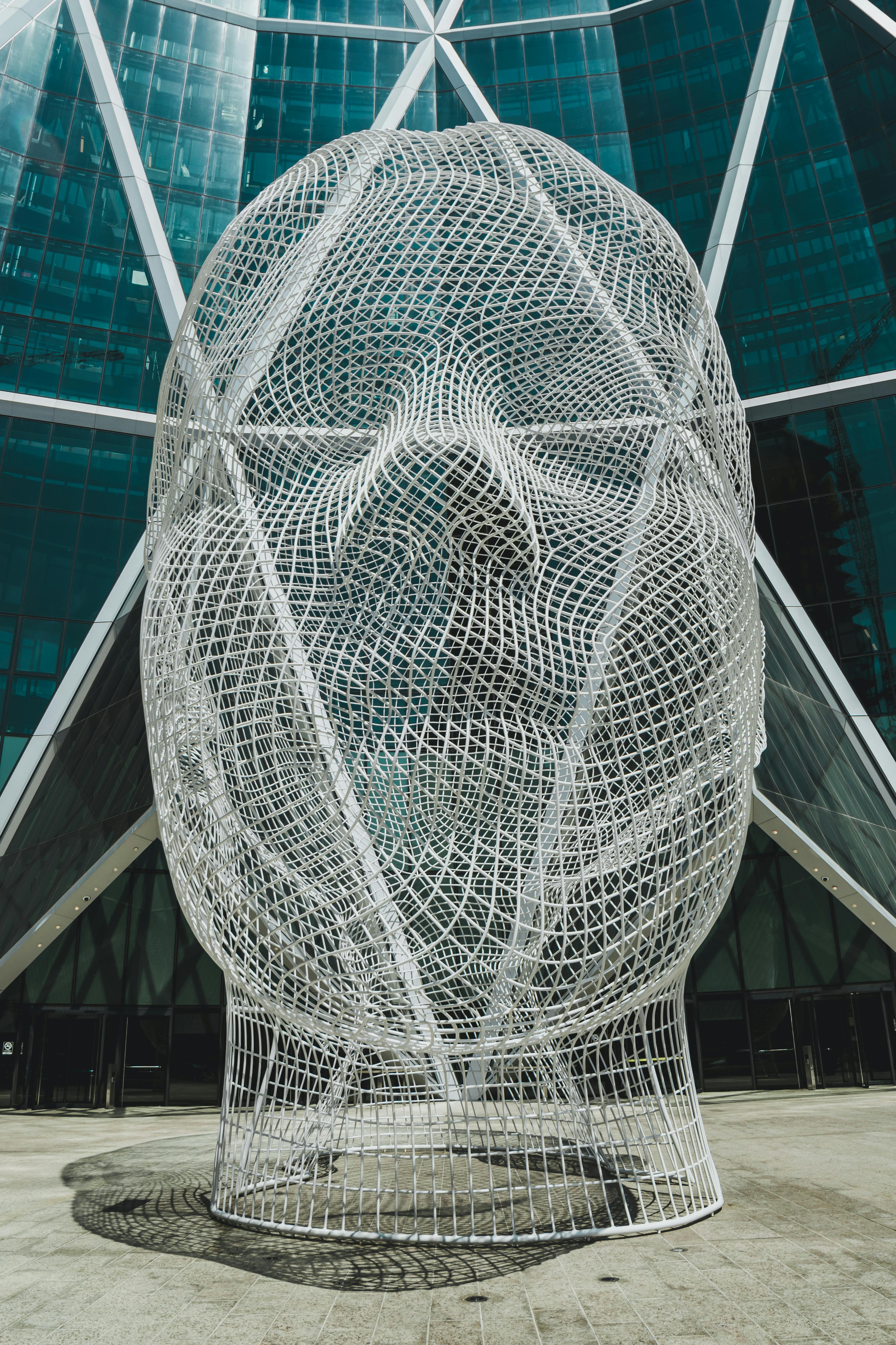 creative huge wire sculpture located on skyscraper base