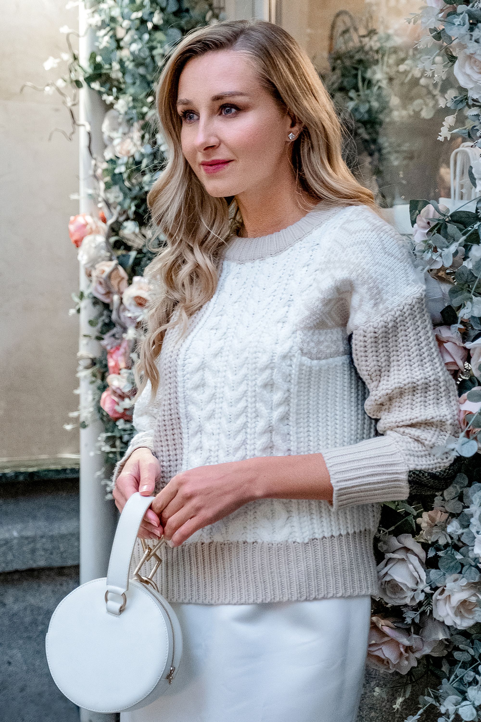 Woman in cable knit with skirt and accessories
