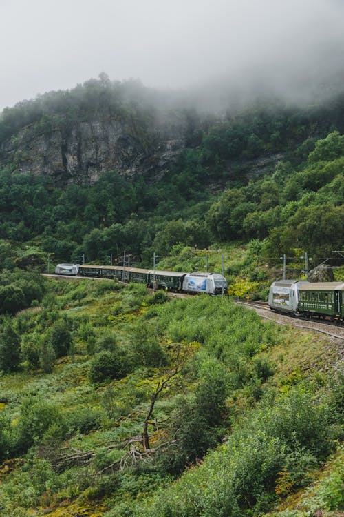 Railroad with train in mountainous terrain
