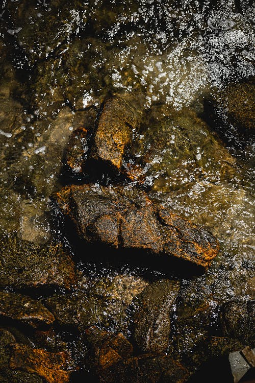 Backdrop of rough stones in pure sea water