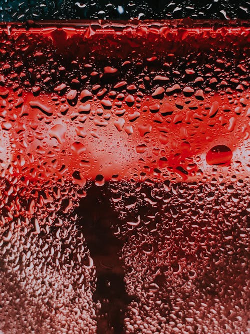 Free Wet glass against red light Stock Photo