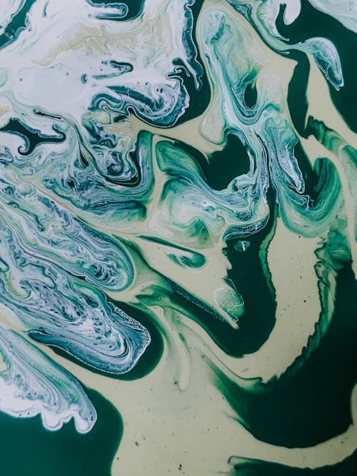 Free Top view of abstract creative artwork with colorful paints mixed in technique of fluid art Stock Photo