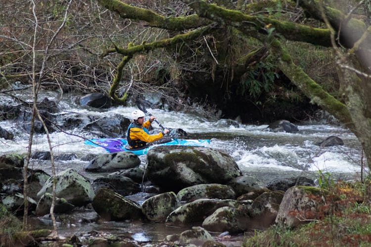 A Man Doing Whitewater Kayaking