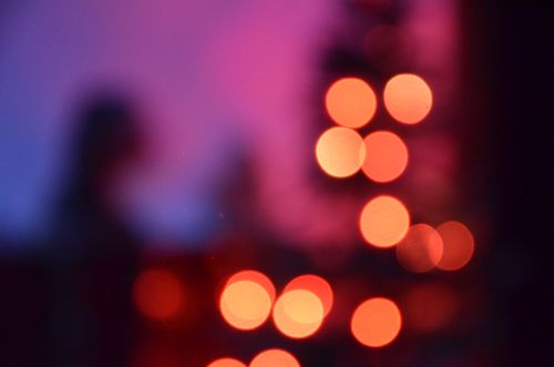 Free Colorful abstract bokeh with circular light patterns in a red and purple hue. Stock Photo