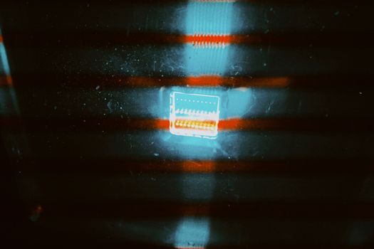 Abstract image featuring vivid light reflections on a dark background, creating an intriguing pattern.
