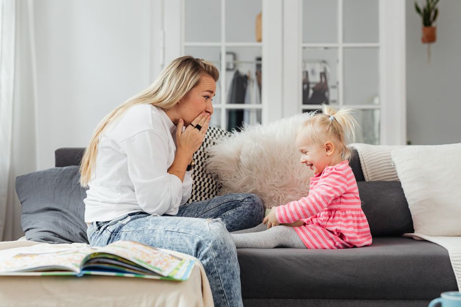 Photo by https://kaboompics.com/ on Pexels A loving moment between mother and daughter laughing together on a sofa in a cozy living room. - Photo by https://kaboompics.com/ on Pexels