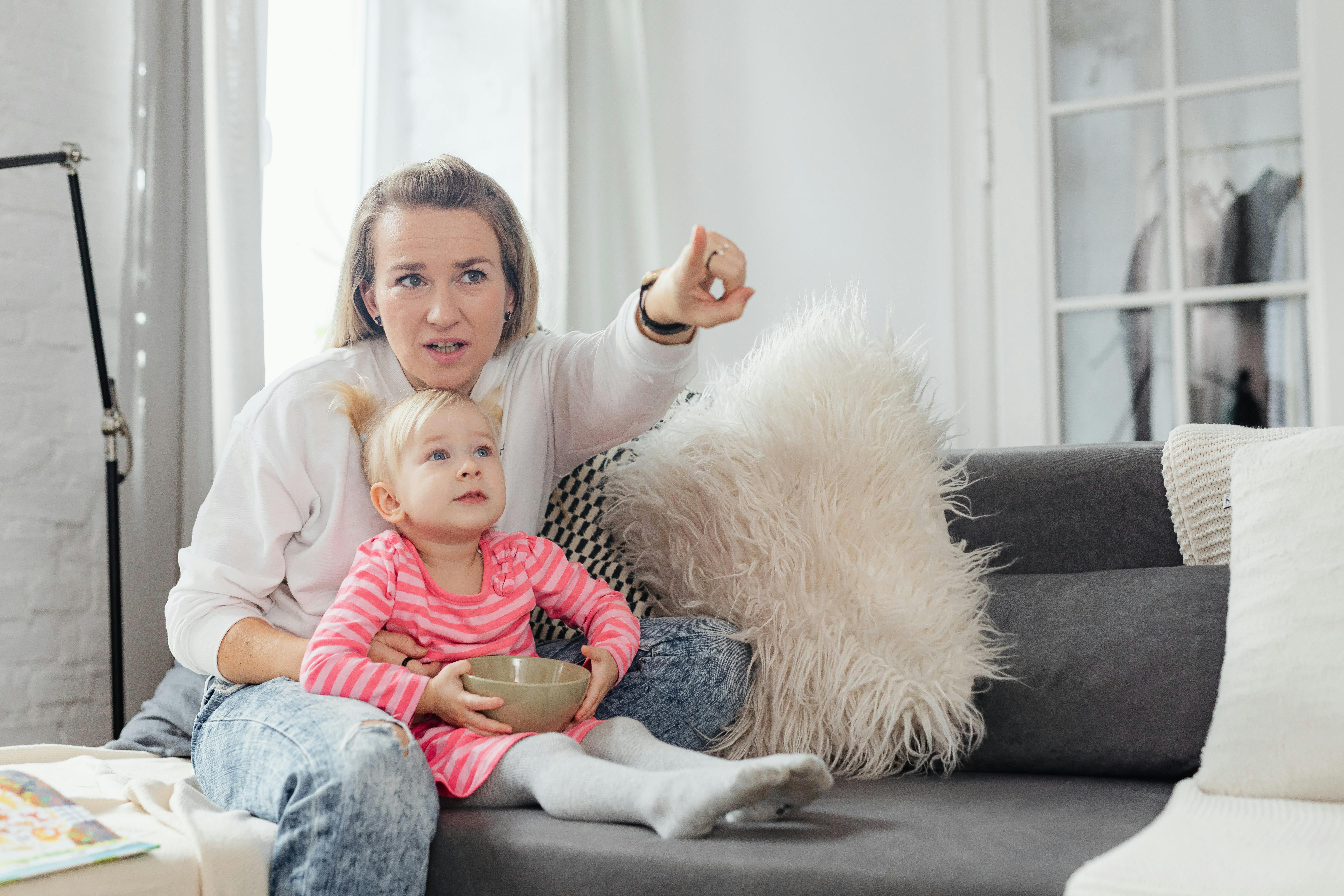 woman watching tv with daughter