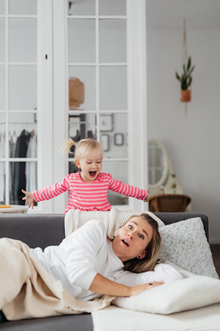 A Girl Waking Up Her Mother