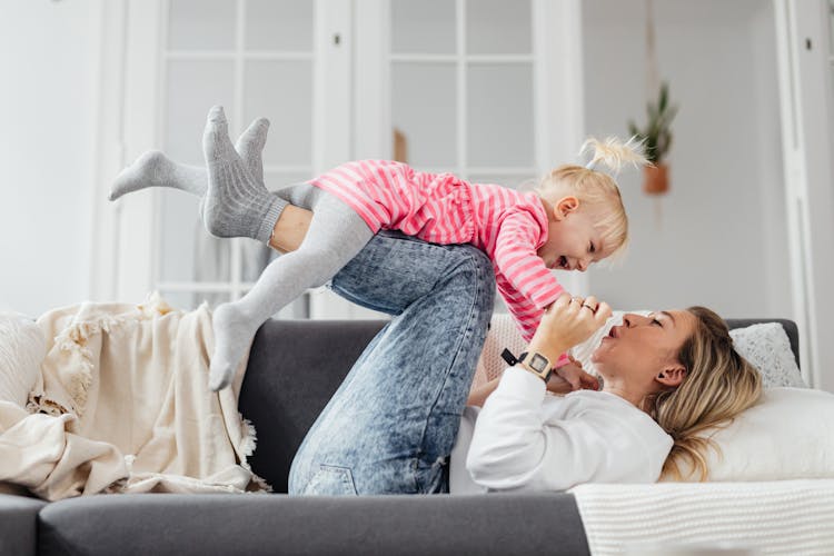 Mother And Daughter Playing And Laughing 