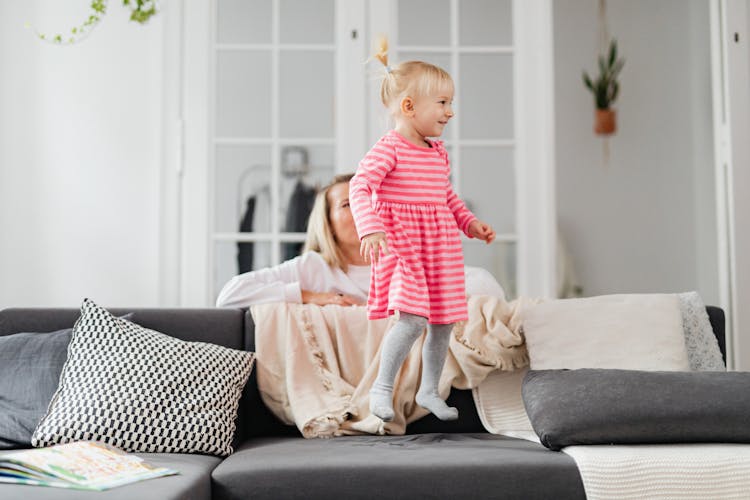 Girl Jumping On The Couch