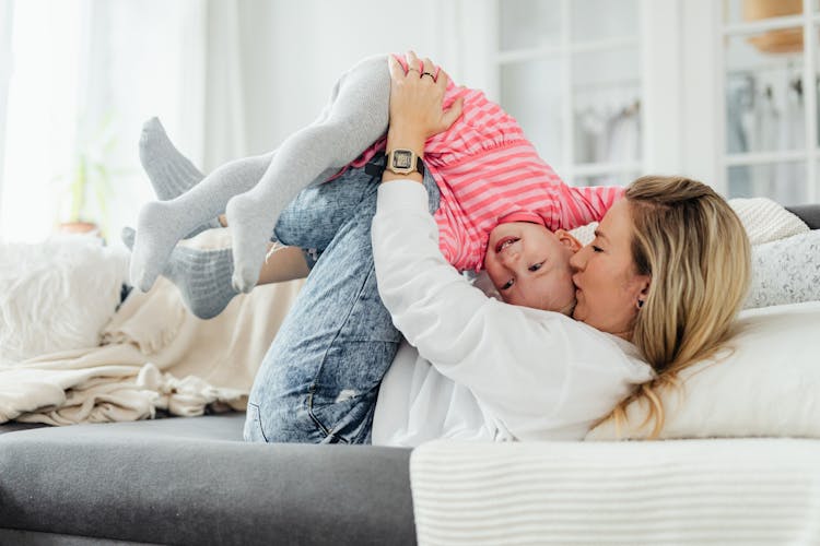 Mother Kissing Her Daughter's Head