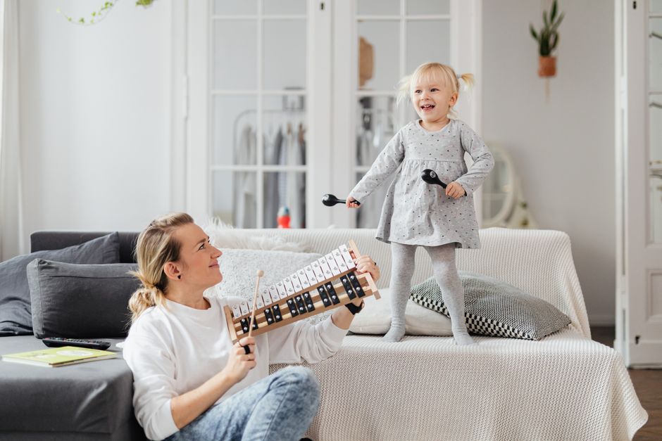 Photo by https://kaboompics.com/ on Pexels A mother and daughter bond through music at home, playing joyful melodies. - Photo by https://kaboompics.com/ on Pexels