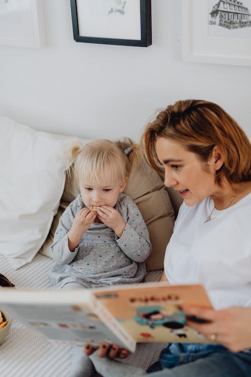 A Mother Reading Her Daughter A Book