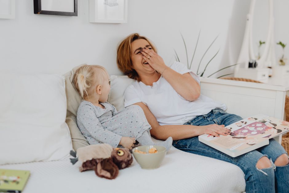 Photo by https://kaboompics.com/ on Pexels A joyful moment of a mother and child sharing laughs while reading together indoors. - Photo by https://kaboompics.com/ on Pexels