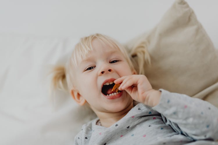 Cute Girl Eating A Snack