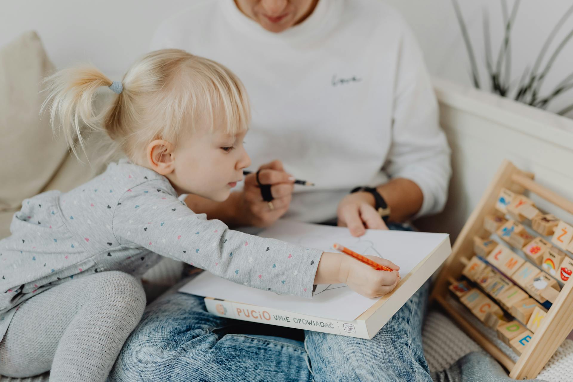 A Girl Drawing on a Paper