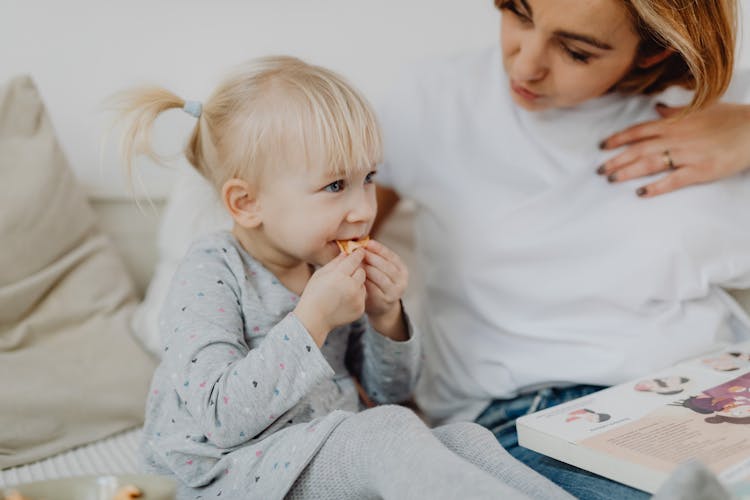 Cute Little Girl Eating Her Snack