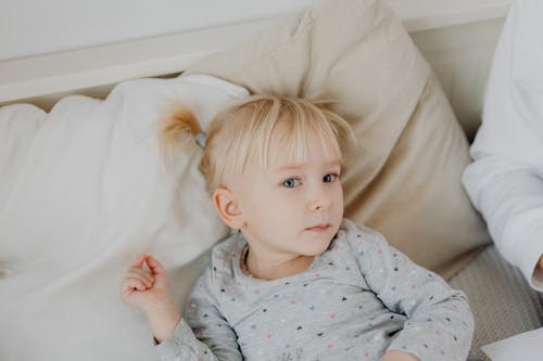 A Girl Lying Down in a Couch