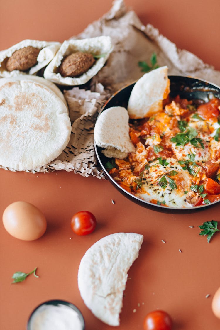 Arabian Food In A Pan On An Orange Surface