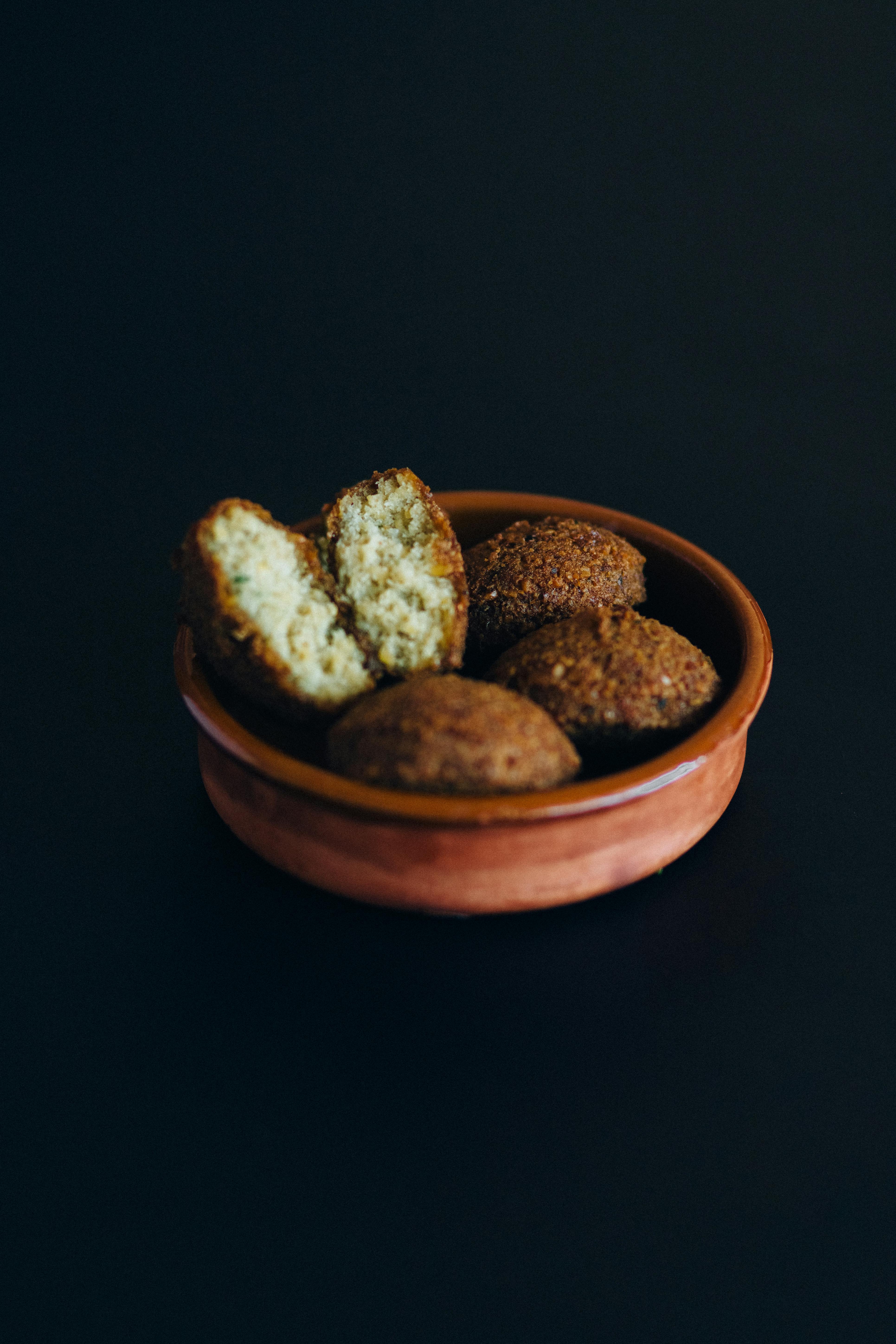 brown cookies on brown round bowl