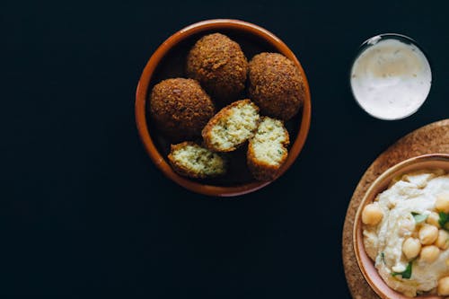 Free Overhead Shot of Fried Falafels Near a Hummus Dip Stock Photo