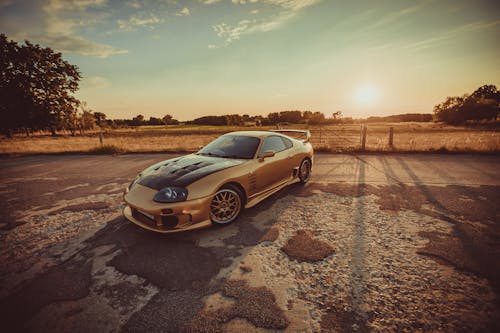 A Gold Toyota Supra 