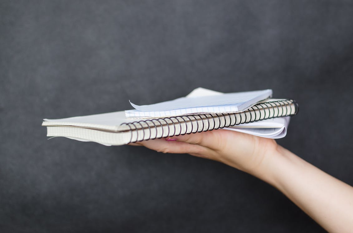 Free Person Holding Notebook Stock Photo