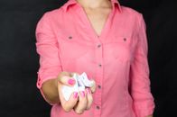 Woman Holding Crumpled Paper