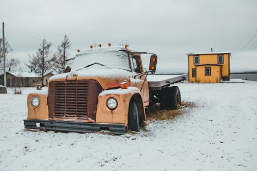 Truck on snowy terrain in countryside