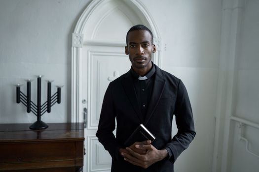 A Man Holding a Bible