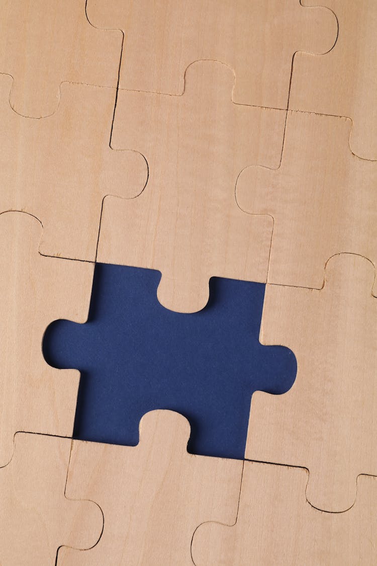 Close-Up Shot Of Wooden Puzzle Pieces