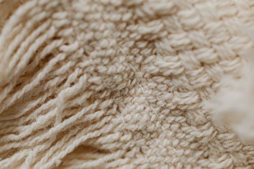 Close-Up Shot of a Beige Textile