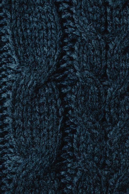 Free Macro shot of dark blue knitted fabric texture perfect for textile backgrounds. Stock Photo