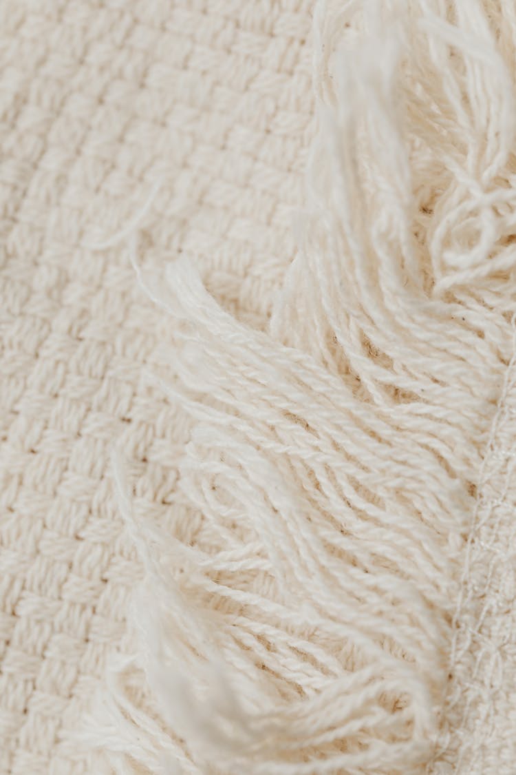 Close-Up Shot Of White Knit Textile