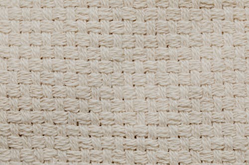Free Close-Up Shot of a Beige Knitted Textile Stock Photo