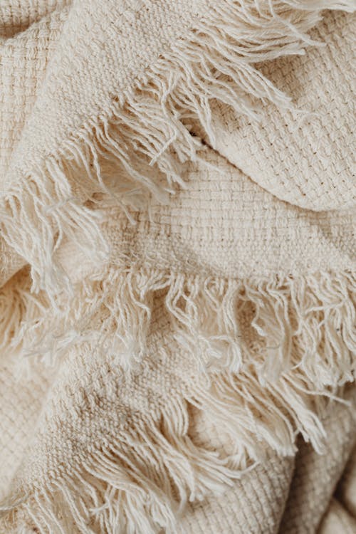 Free Close-Up Shot of White Knit Textile Stock Photo