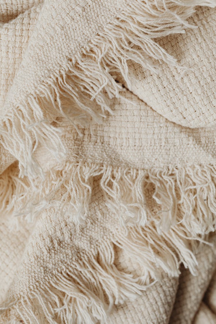 Close-Up Shot Of White Knit Textile