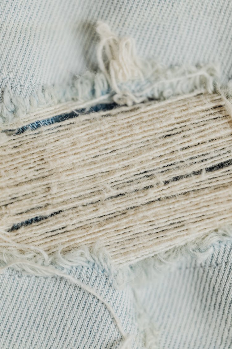 Close Up Of Ripped Jeans Fabric