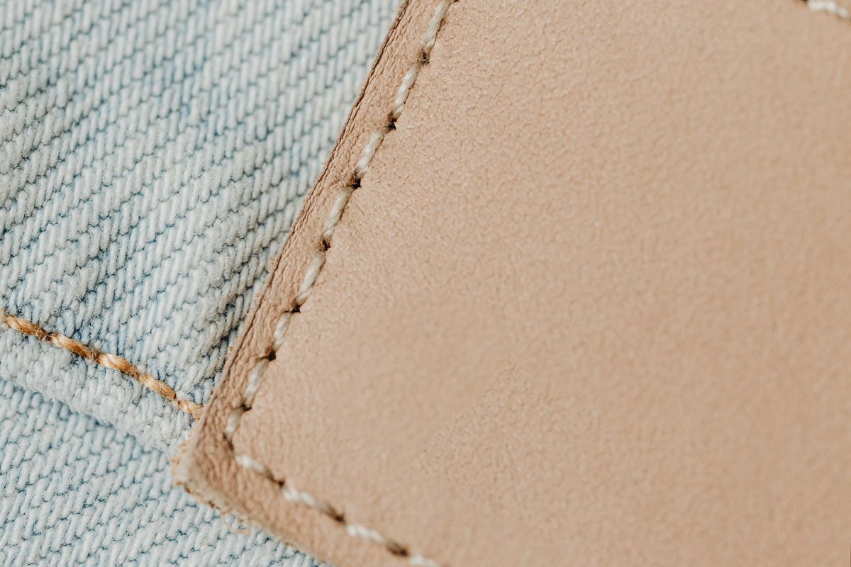Close-up of a stitched label patch on fabric